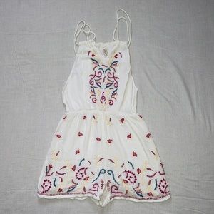 white romper w/ colorful detailing